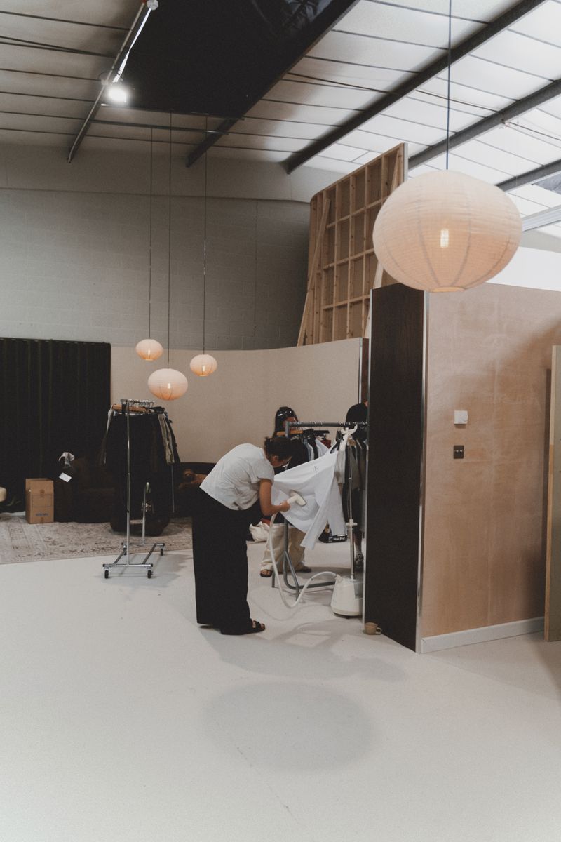 Rails and styling laid out across the studio floor.