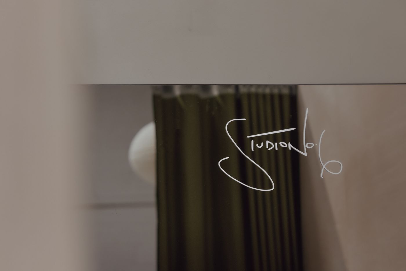Handwritten Studio No.6 mark on the studio mirror.